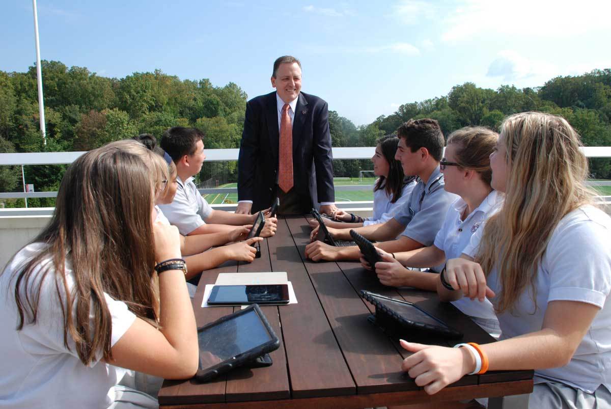 President Jeffrey Mancabelli and a group of students